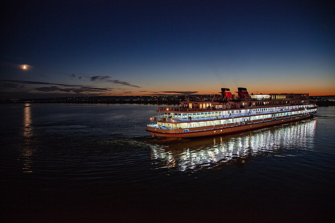 River cruise ship Semyon Budyonny on Volga River at night, Kazan, Kazan District, Republic of Tatarstan, Russia, Europe