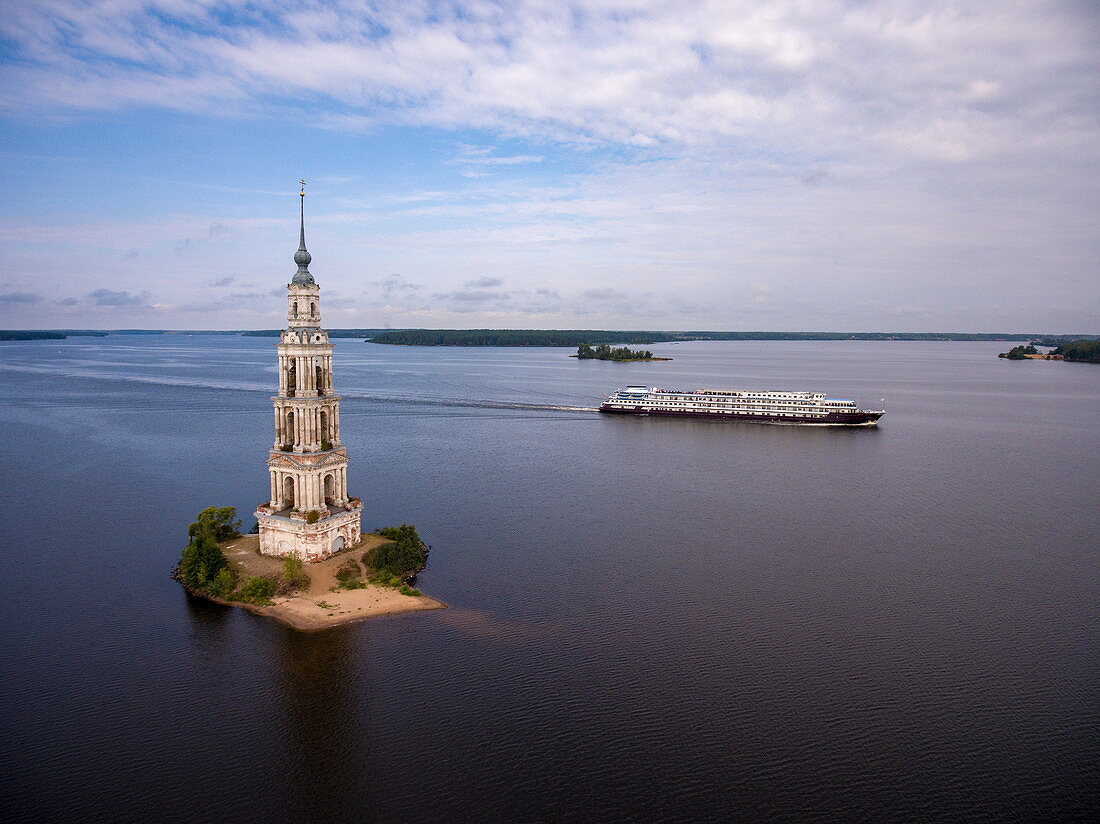 Aerial view of the river cruise ship Excellence Katharina (formerly MS General Lavrinenkov) while passing the Kalyazin bell tower in the Volga river (which is all that is left of the old town of Kalyazin after the Uglich reservoir was flooded), Kalyazin, Tver district, Russia, Europe
