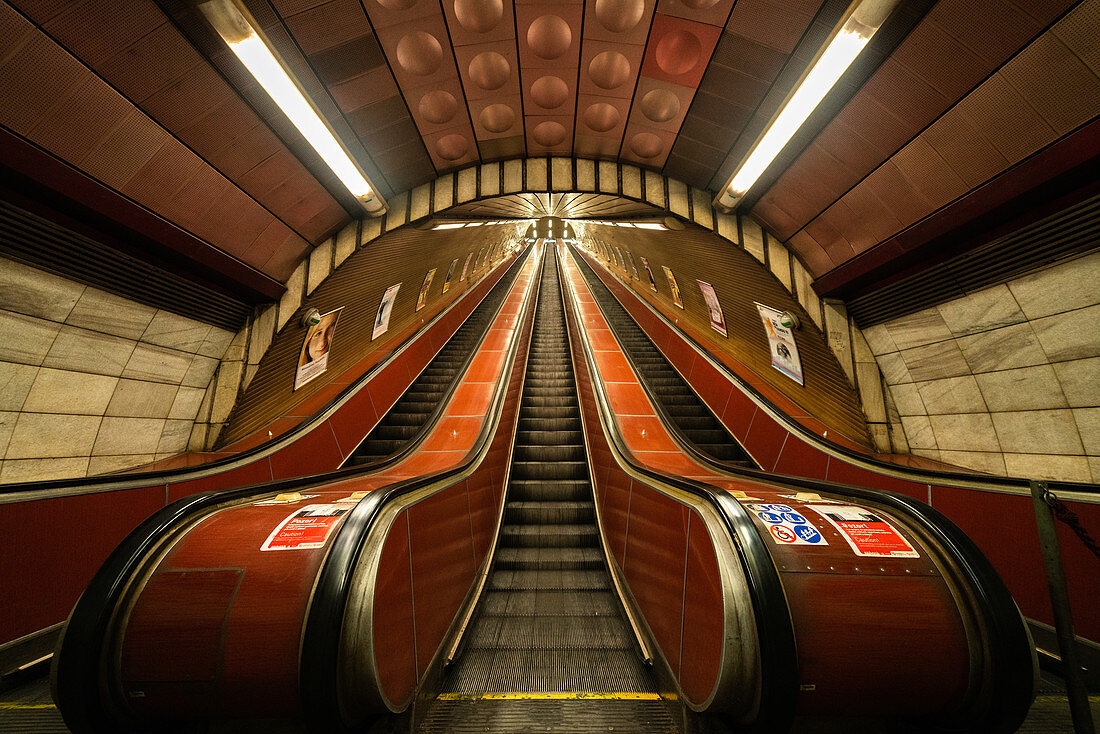 Low angle view of escalators in underground station in Prague city