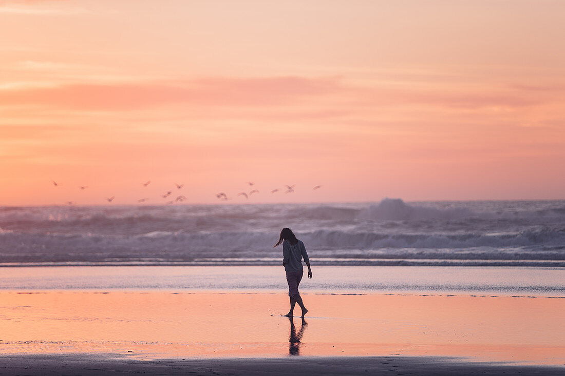 Woman walks on the beach in sunset, Portugal, beach, vacation