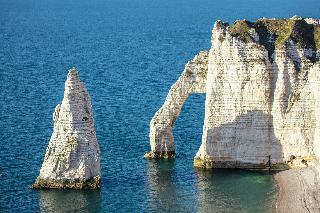 Close-up of the Porte d'Aval (elephant trunk) arch and the Aiguille rock needle on the Alabaster Coast near Étretat, Normandy, France.