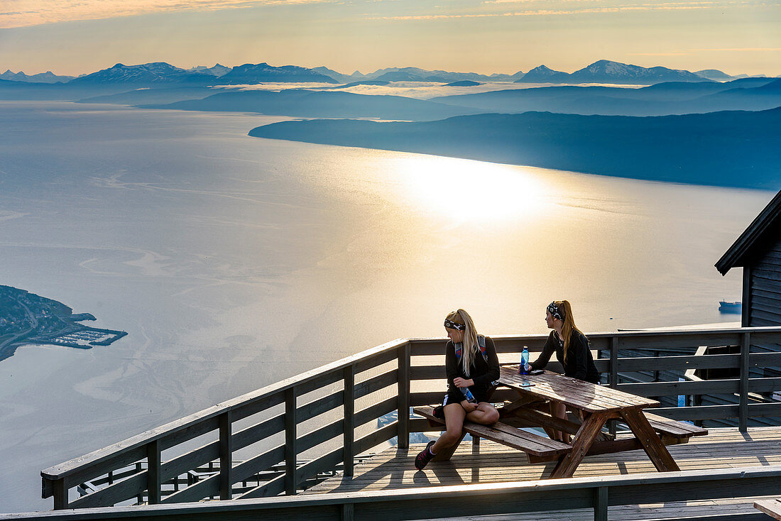 Two young women on terrace, from Fagernesfjell you have a great view of the Ofotfjord and, Narvik, Norway