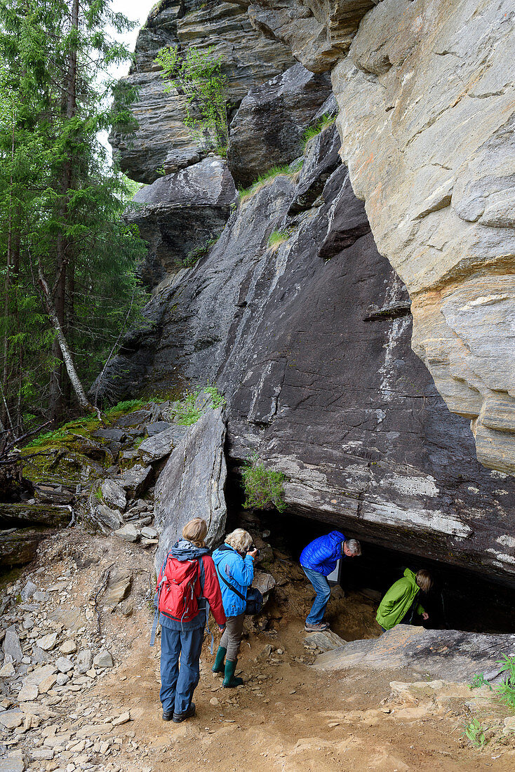 Guided tour of the Grønligrotte cave, south of the Svartisen glacier, Norway