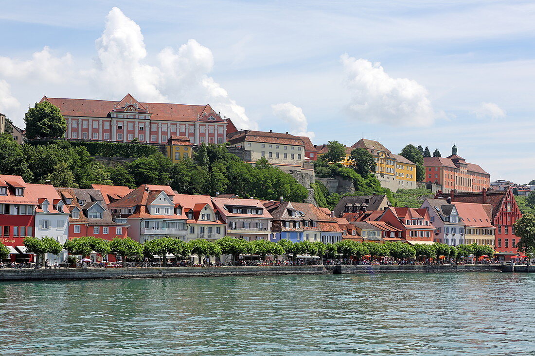 View over Lake Constance to the promenade of the town of Meersburg with its medieval castle, Baden-Wuerttemberg, Germany