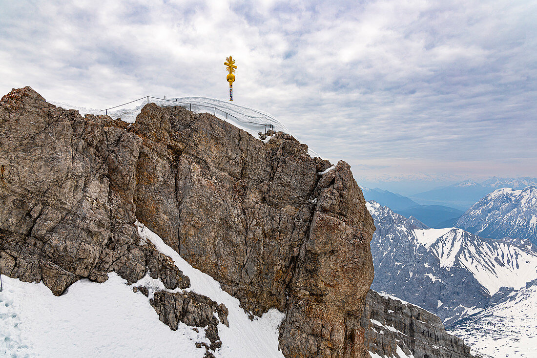 View from Zugspitze summit to summit cross and mountain landscape, Grainau, Upper Bavaria, Germany