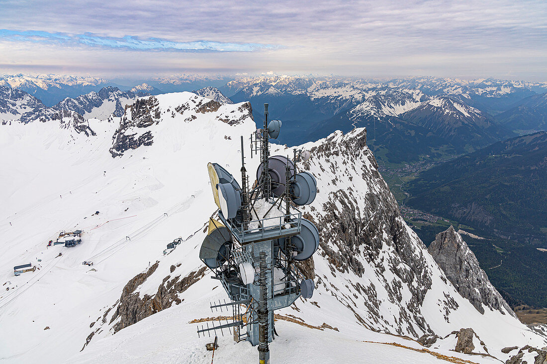 View from Zugspitze summit to surrounding snow-covered mountain landscape, Grainau, Upper Bavaria, Germany