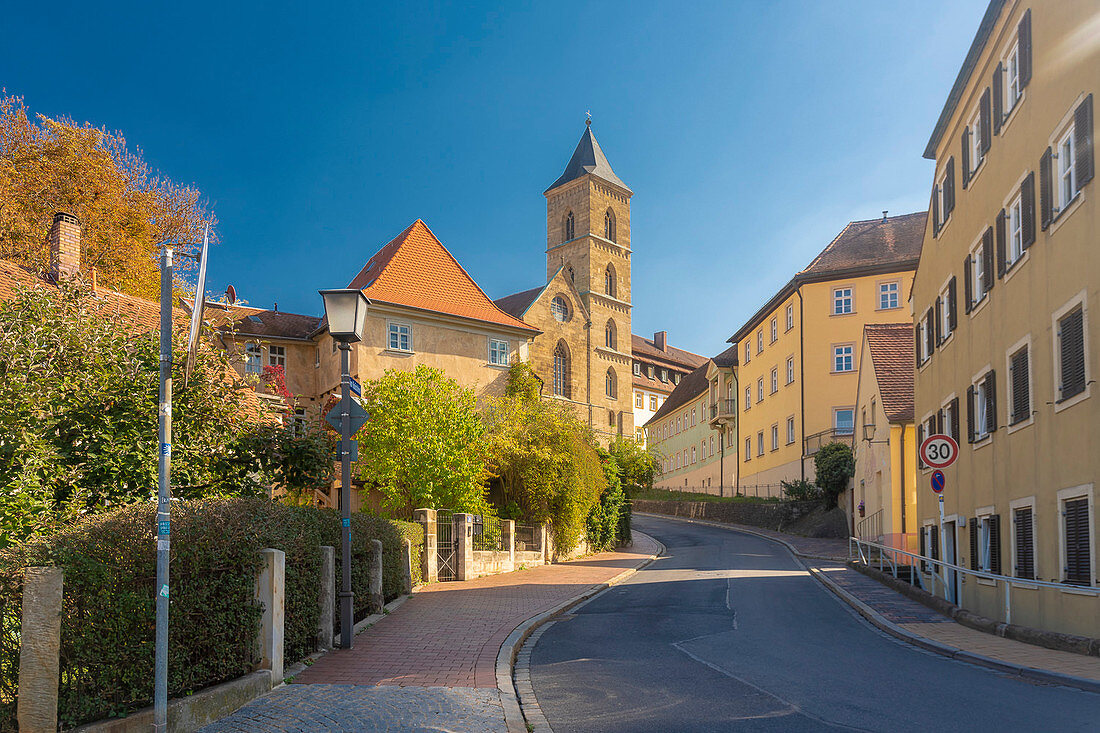 Germany, Bavaria, Bamberg, Empty street with church tower