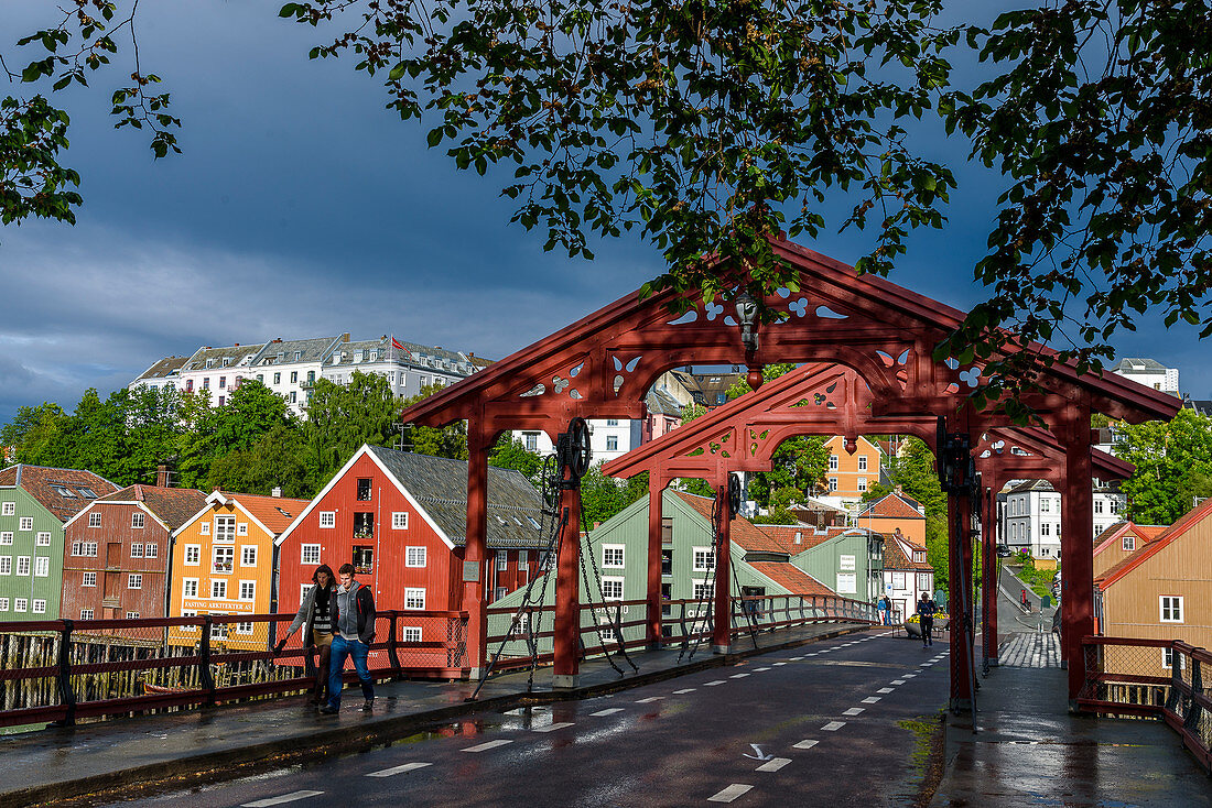 Bybrua bridge on the Nidelv river with old warehouses, Trondheim, Norway