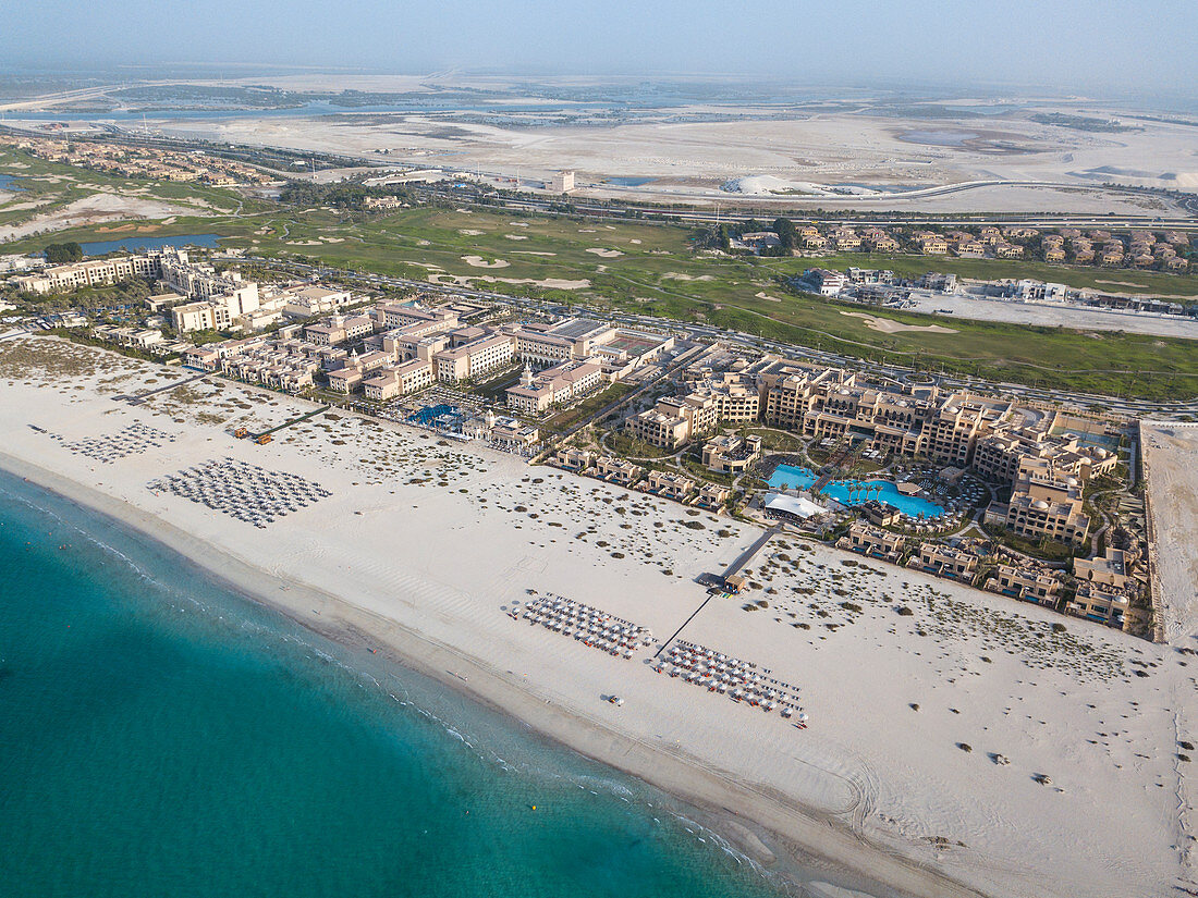 Aerial of Saadiyat Rotana Resort & Villas (right) and other beachfront hotels with beach and sea, Saadiyat Island, Abu Dhabi, United Arab Emirates, Middle East