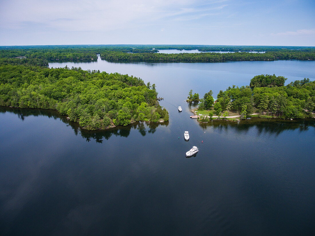 Aerial view of three Le Boat Horizon houseboats on Indian Lake, near Chaffey's Lock, Ontario, Canada, North America