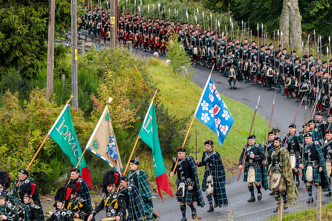 Men of Lonach parade, pipe band in highland dress, Strathdon, Aberdeenshire, Scotland UK