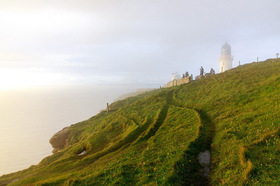 Dunnet Head lighthouse in the sea mist, Caithness, Scotland's northernmost point, UK