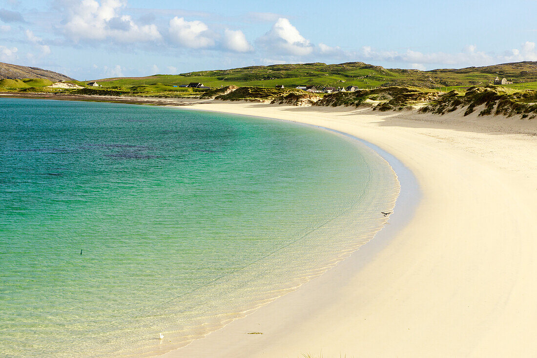 white sandy Vatersay beach, causeway, grass dunes, Isle of Barra, Outer Hebrides, Scotland UK