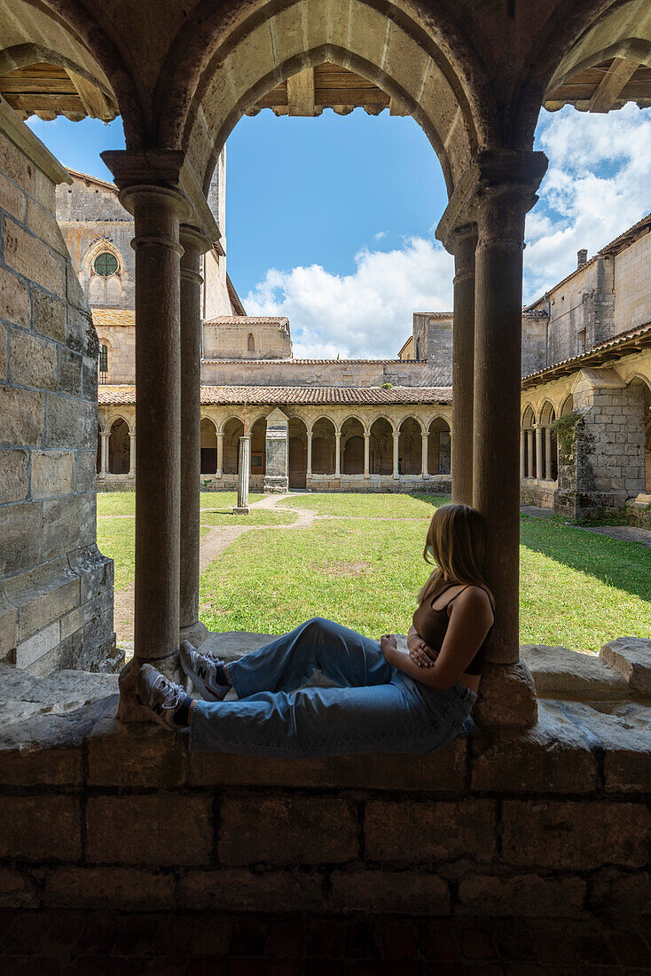 Young people in the Cordeliers Cloister monastery in the wine town of Saint Emilion, Unesco World Heritage, France