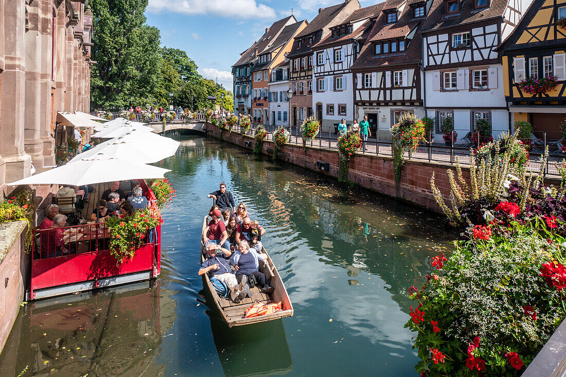 Half-timbered houses in Little Venice, wooden boat with tourists, canal, Colmar, Alsace, France, Europe
