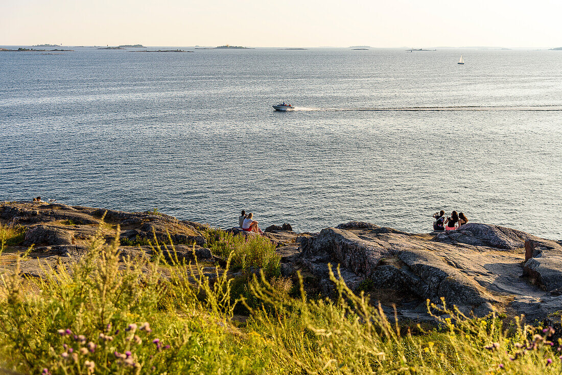 Suomenlinna fortress island, people picnicking and bathing, Helsinki, Finland