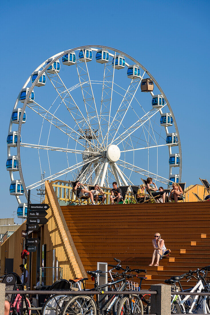 Roof terrace of Allas Sea Pool and ferris wheel with sauna gondola at the harbor, Helsinki, Finland