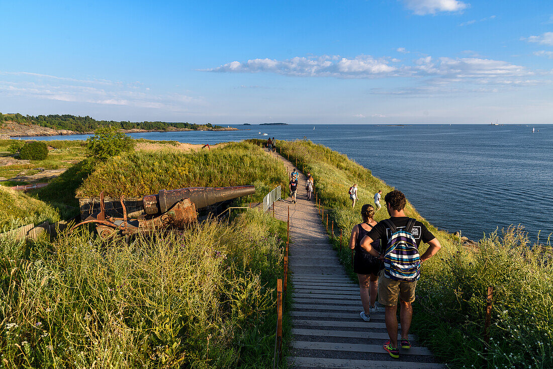 Walkers, recreational area and fortress on the island of Suomenlinna off Helsinki, Finland