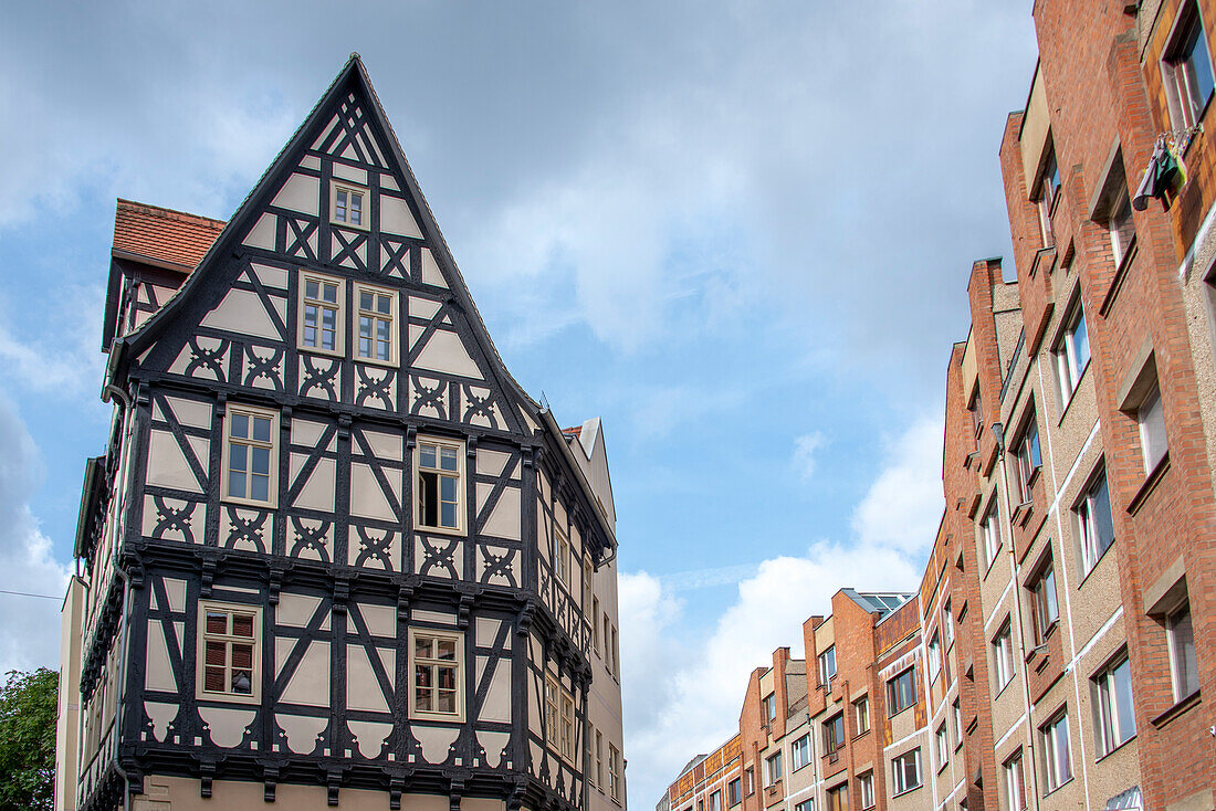 Historic half-timbered house, next to it redesigned prefabricated buildings, Grasweg, Halle an der Saale, Saxony-Anhalt, Germany