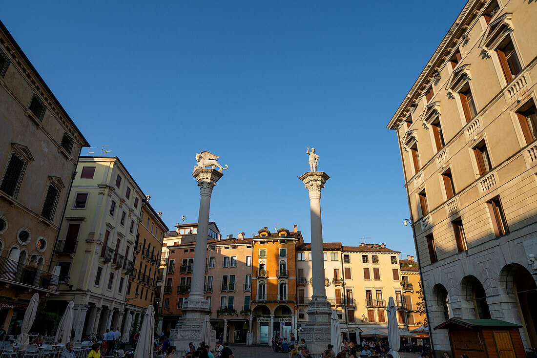 Columns on the Piazza dei Signori with statues, on the left the Lion of St. Mark, on the right &#39;Il Redentore'39;, Vicenza, Veneto; Italy.