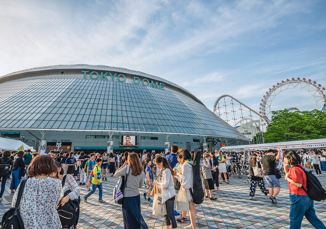 Local visitors in front of the Tokyo Dome Arena, Tokyo, Japan