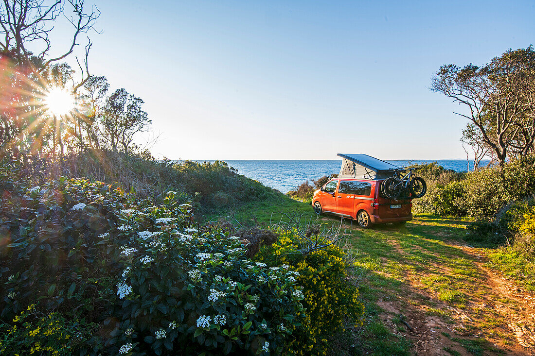 Road trip Croatia, in the evening with the camper on the coast