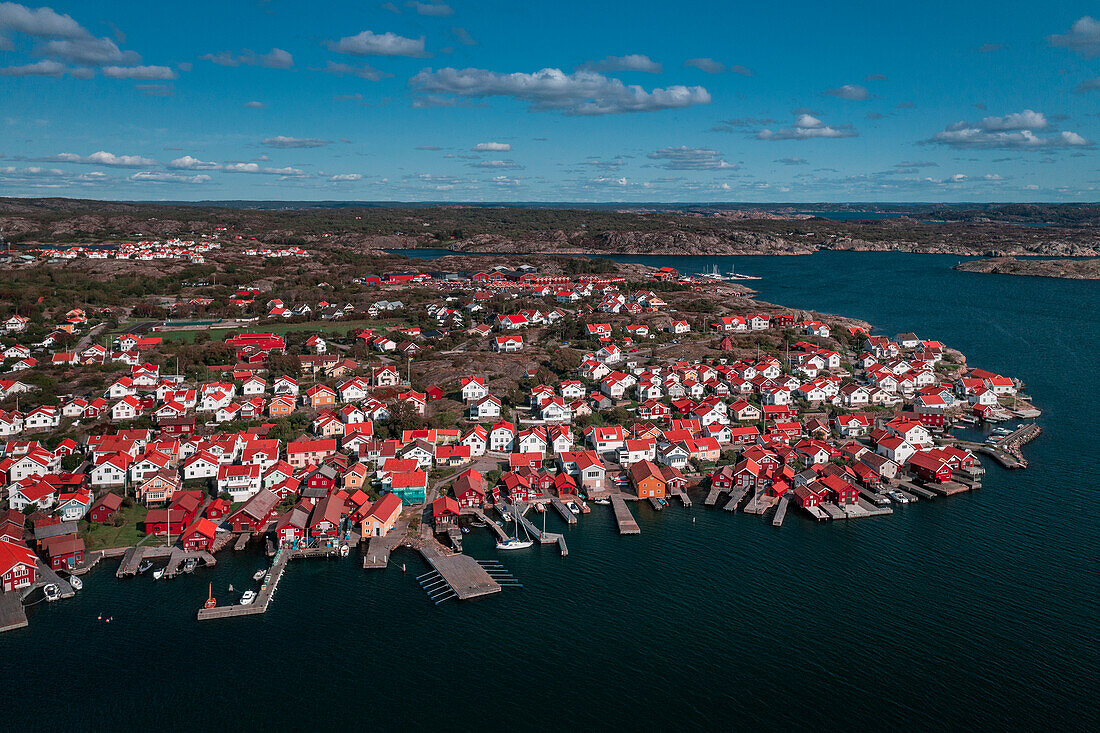 Coast and village of Mollösund on the archipelago island of Orust on the west coast of Sweden from above, sunshine on the day with a blue sky