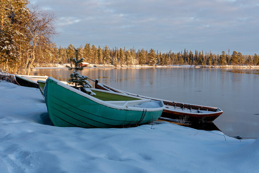 Snow-covered boats at Särkijervi, Muonio, Lapland, Finland