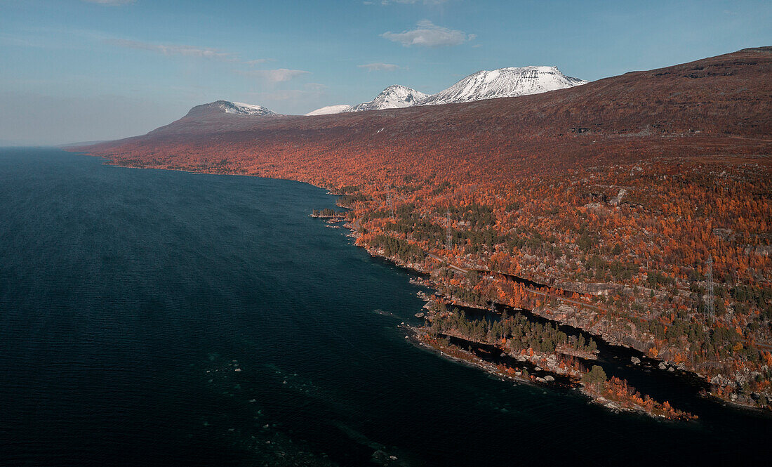 Landscape with mountains and lake in Stora Sjöfallet National Park in autumn in Lapland in Sweden from above