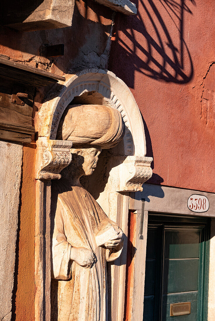 Man with turban, stone sculpture in a columned wall niche at Tintoretto's house, Venice, Veneto, Italy, Europe