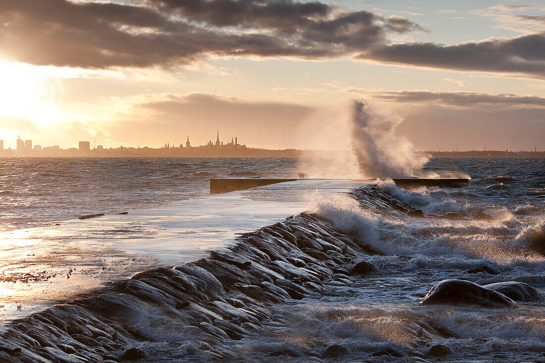A weather storm in the Baltic Sea, waves crashing over a pier