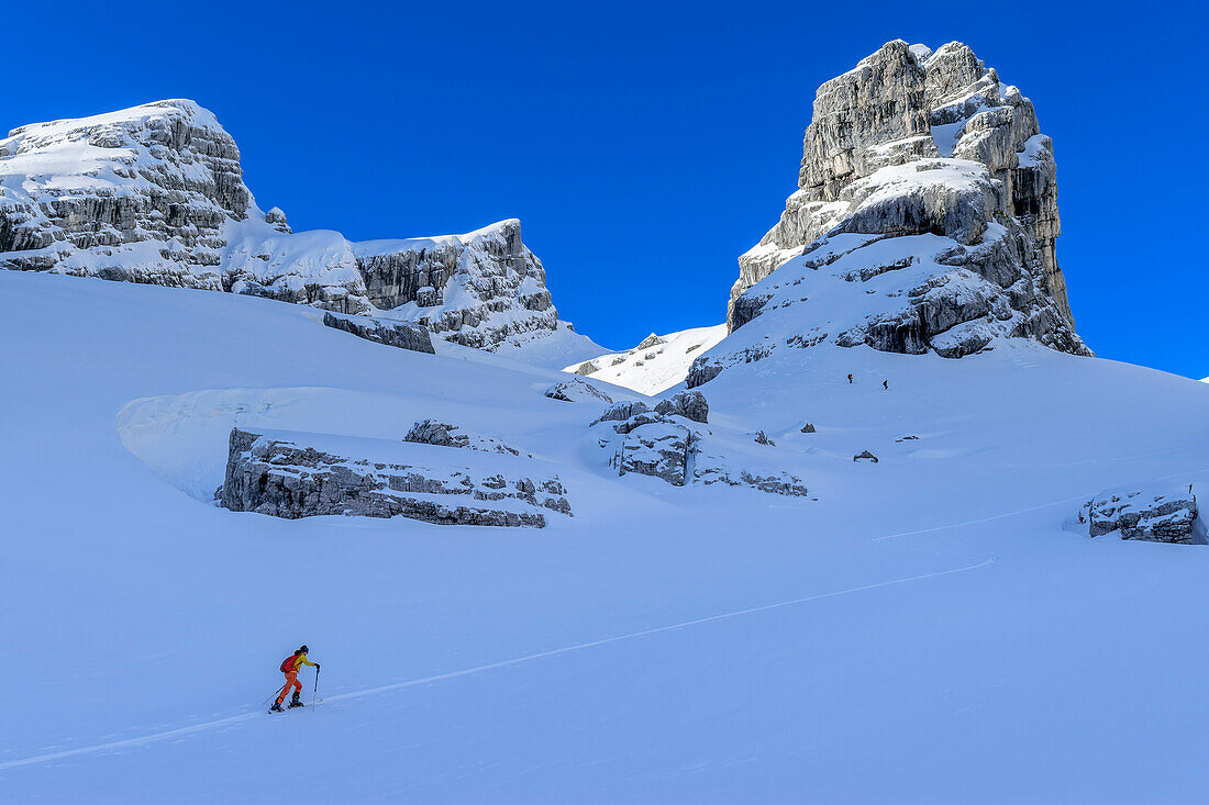 Woman on ski tour climbs up to Watzmannkar, Watzmannkar, Third Watzmannkind, Berchtesgaden Alps, Berchtesgaden National Park, Upper Bavaria, Bavaria, Germany