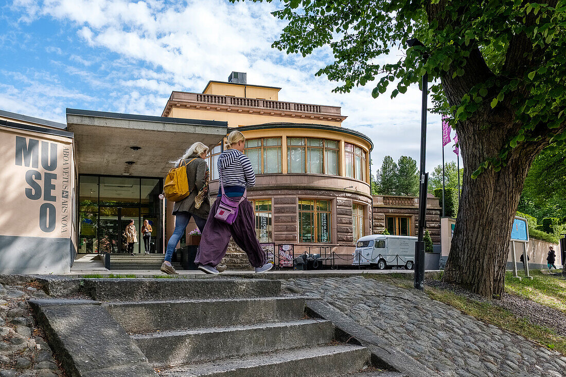 Pedestrians in front of Museum Aboa vetus and Ars nova, Turku, Finland
