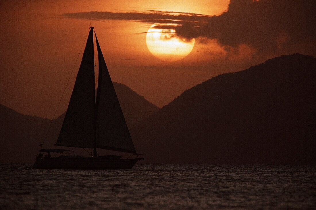Silhouette of a sailboat in the ocean, British Virgin Islands