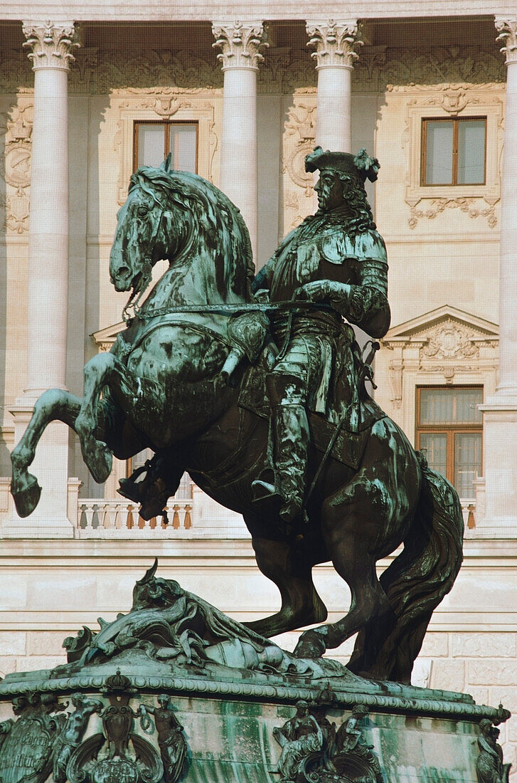 Statue of Prince Eugene of Savoy in front of a palace, The Hofburg Complex, Heldenplatz, Vienna, Austria