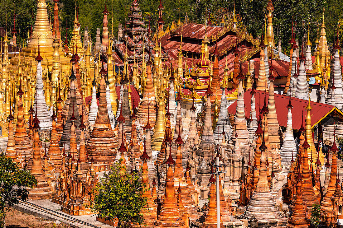 The pagoda forest of In-Dein on the Burmese Inle Lake consists of many ring-shaped tapering stupas Htis as a closure