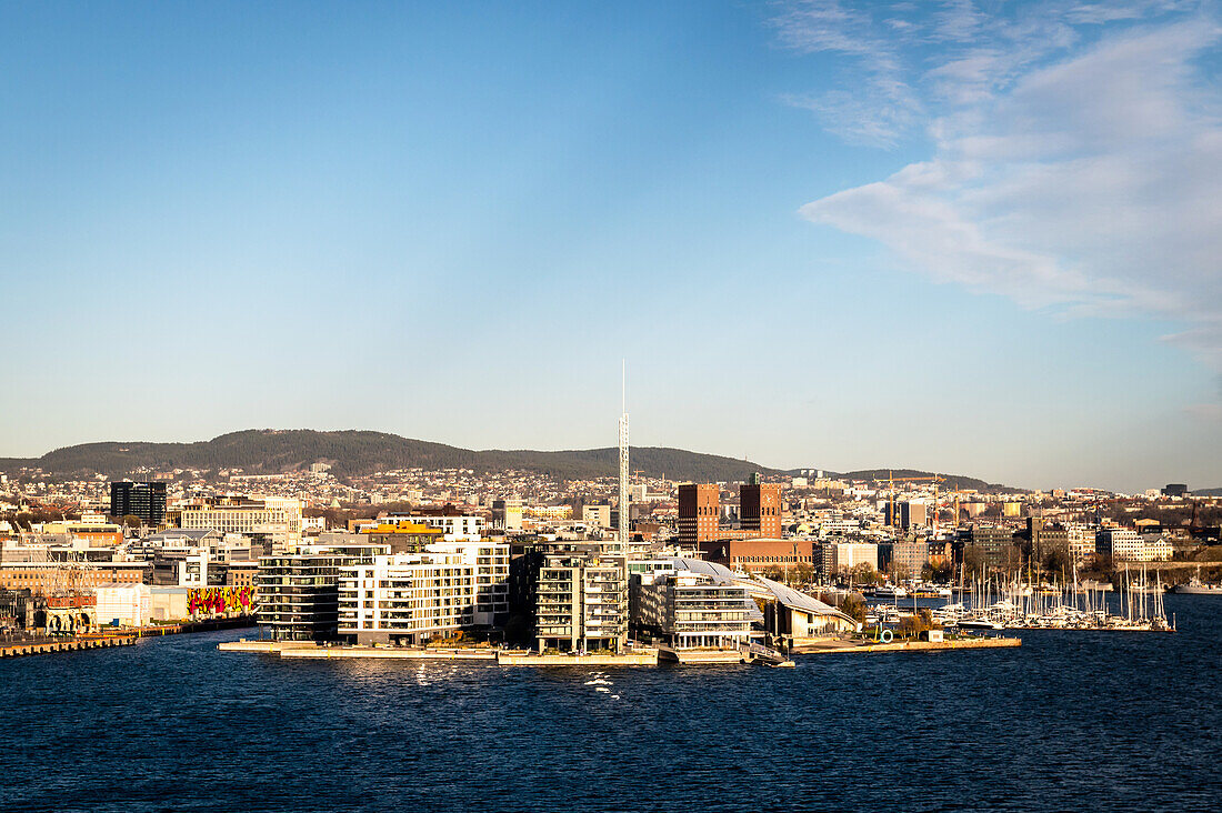 View of the Aker Brygge skyline and City Hall in Oslo, Norway, Europe