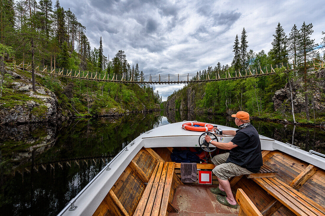 Tour boat on Julma Ölkky canyon lake, Finland