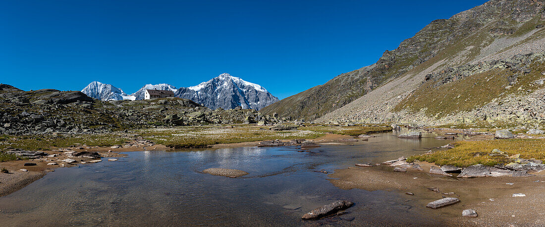 Panorama of the Suldener Dreigestirn with the Düsseldorfer Hütte, from left to right: Königsspitze, Zebru and Ortler. Zaytal, Ortlergiet, Stelvio National Park, South Tyrol, Alto Adige, Italy
