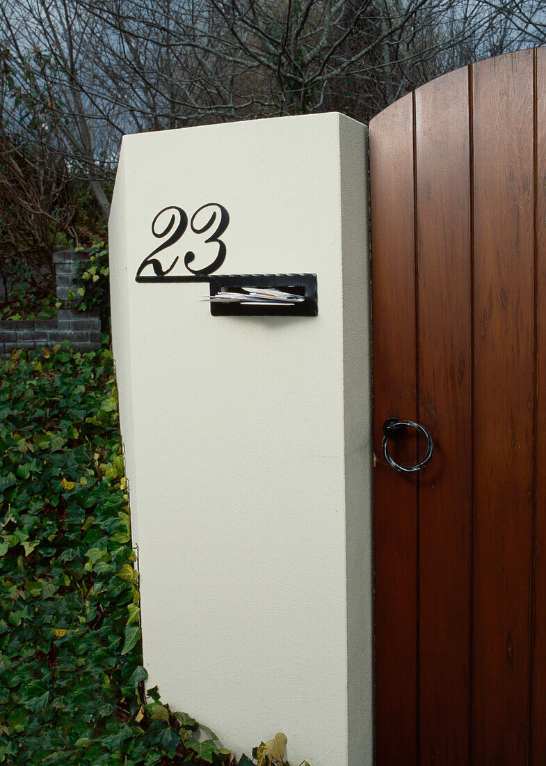 Mail in letterbox at front garden entrance