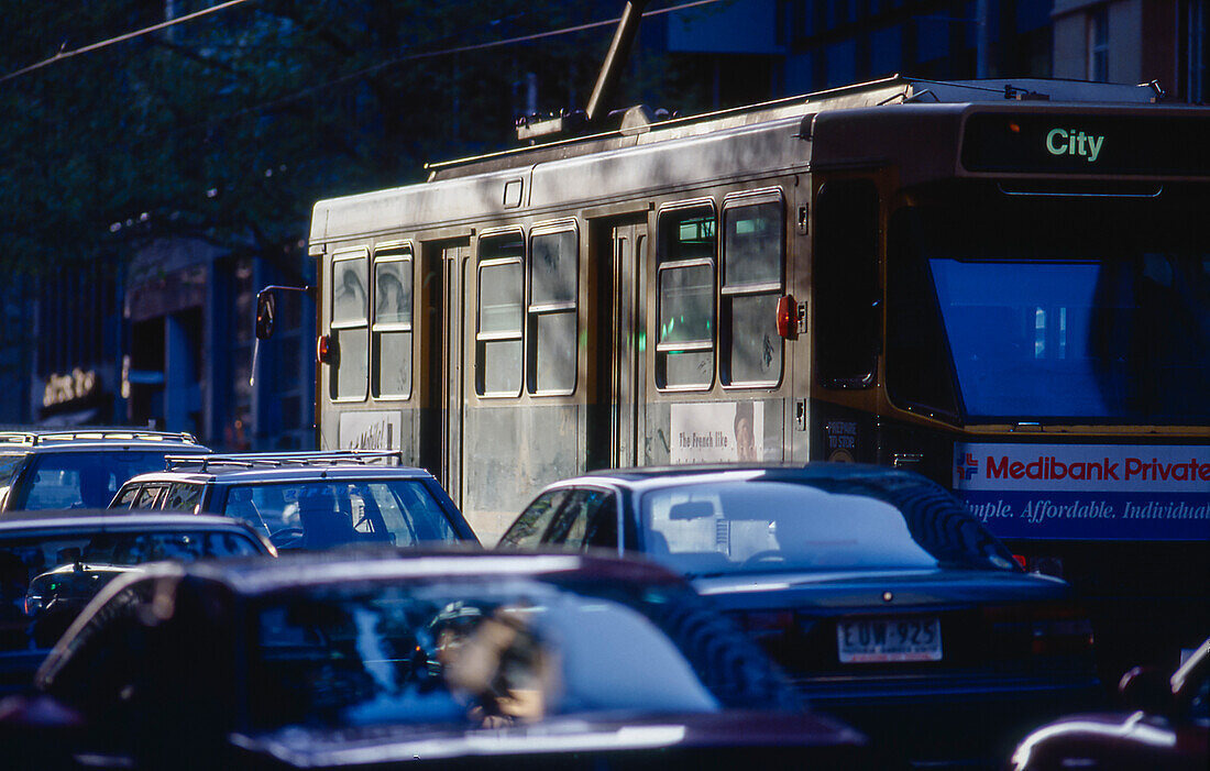 Tram in Melbourne city traffic