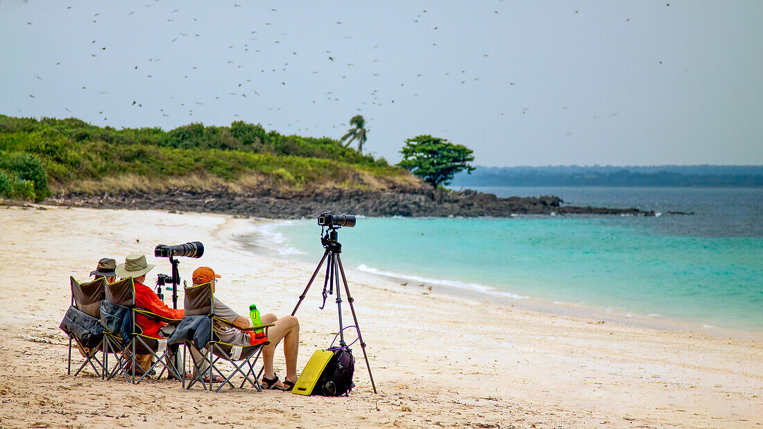 Fotografen, machen Sie eine Pause am Strand