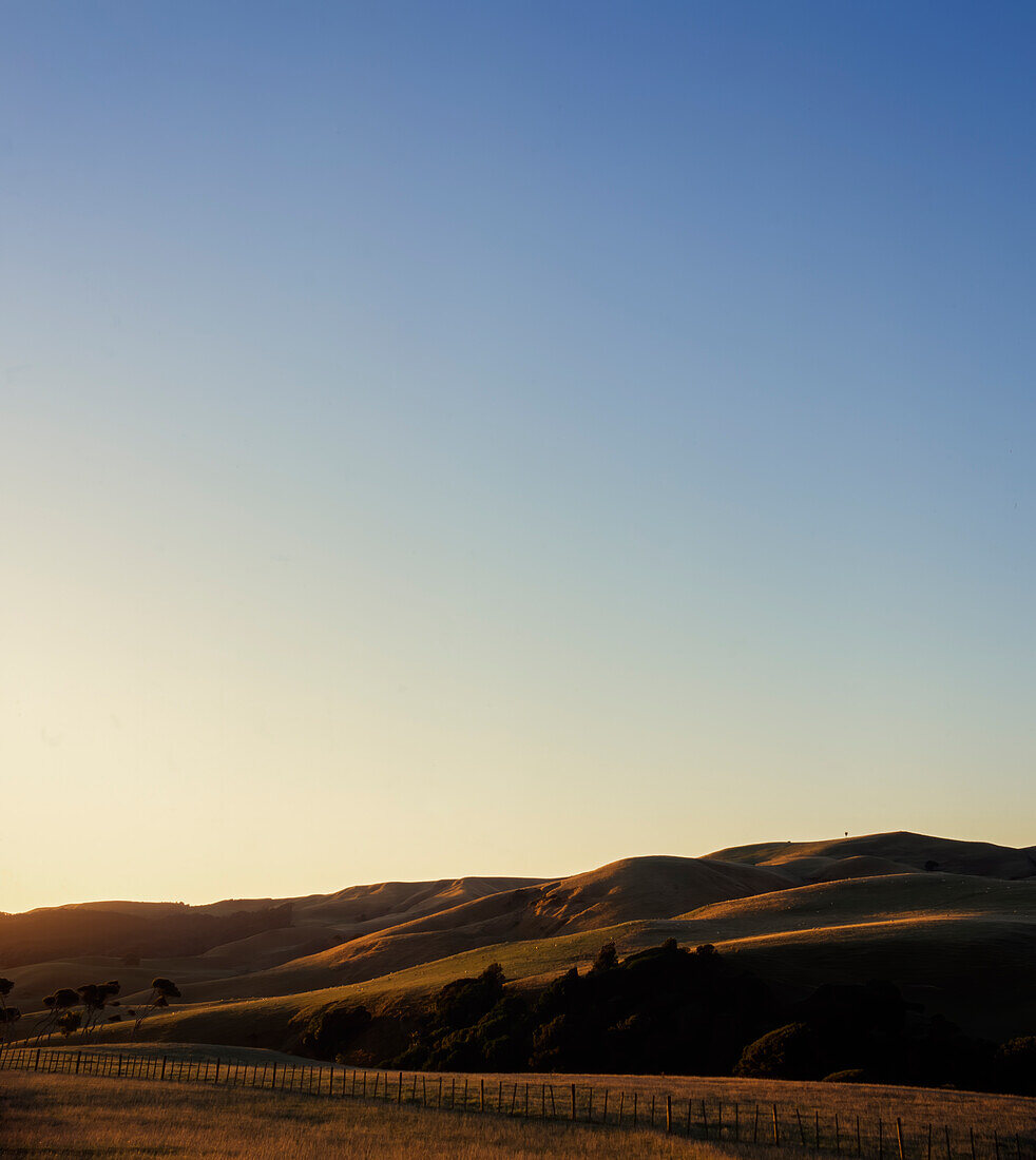 Rolling hills meeting flat pasture on farm