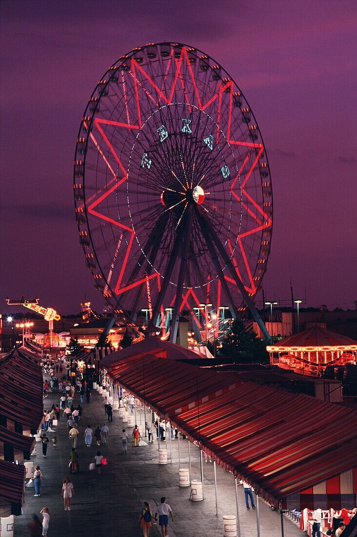 Ferris Wheel and the midway at the Texas State Fair at night, Dallas, Texas, USA