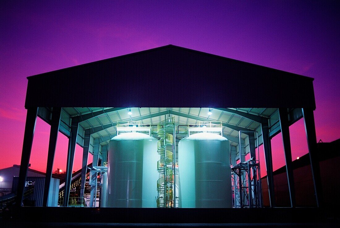 Toxic waste storage tanks at sunset, Texas, USA