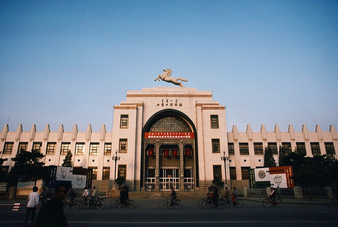 People commuting in front a museum, Inner Mongolia Museum, Hohhot, Inner Mongolia, China