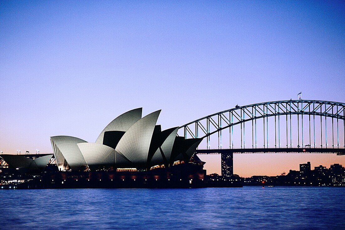 Opera house in front of a bridge, Sydney Opera House, Sydney Harbor Bridge, Sydney, New South Wales, Australia