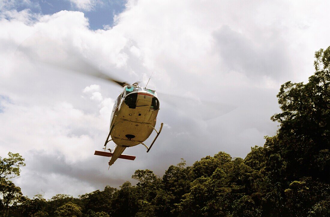 Low angle view of a helicopter, Jayawijaya Mountains, Irian Jaya, New Guinea, Indonesia