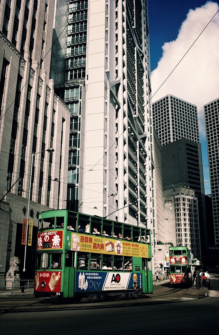 Double-decker trams on tracks in a city, Hong Kong