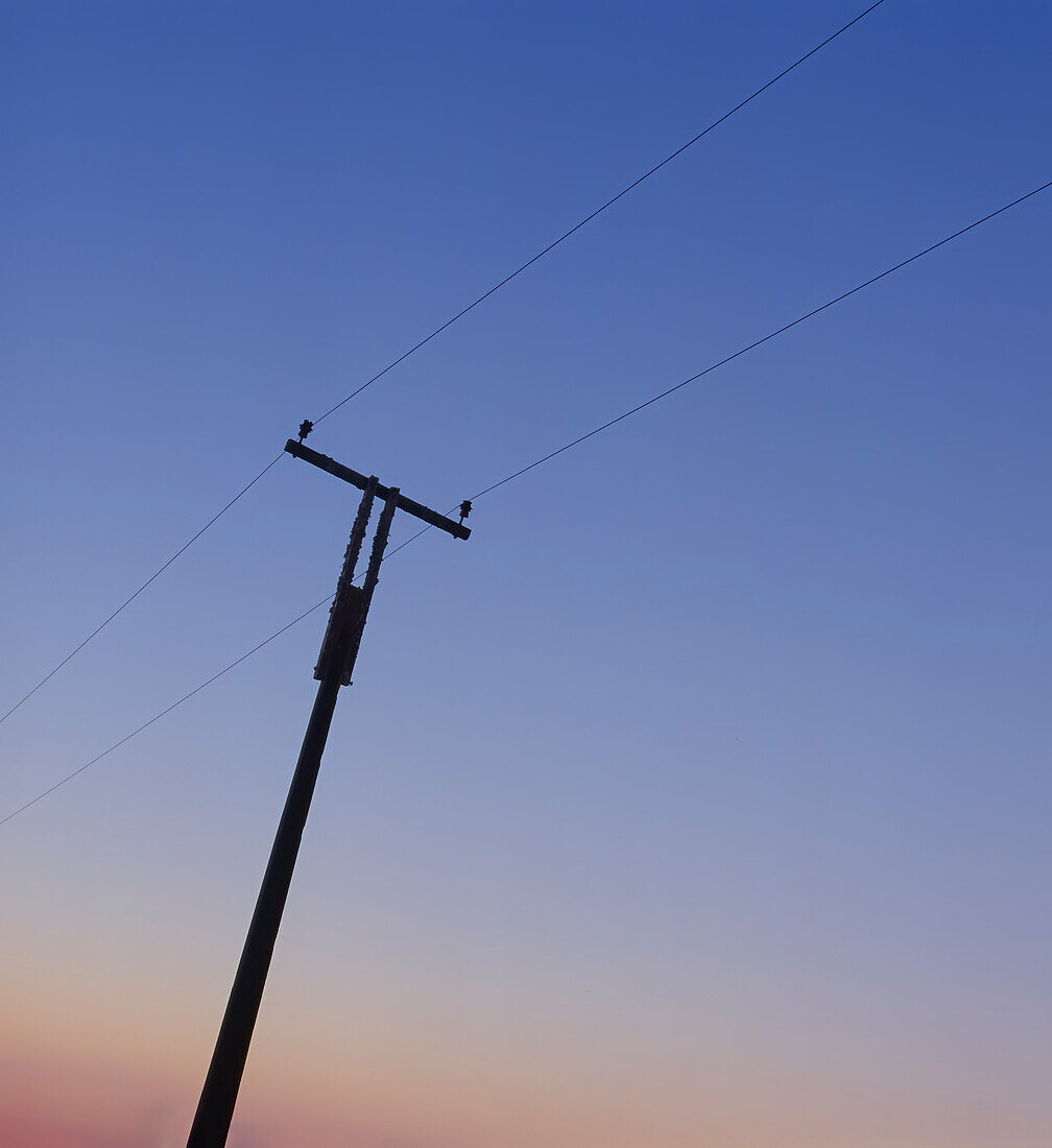 Telephone Pole against sky at dusk